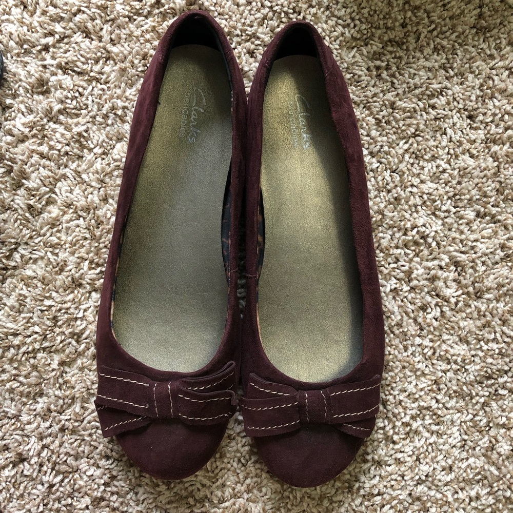 Maroon suede Clark’s flats with bow detail